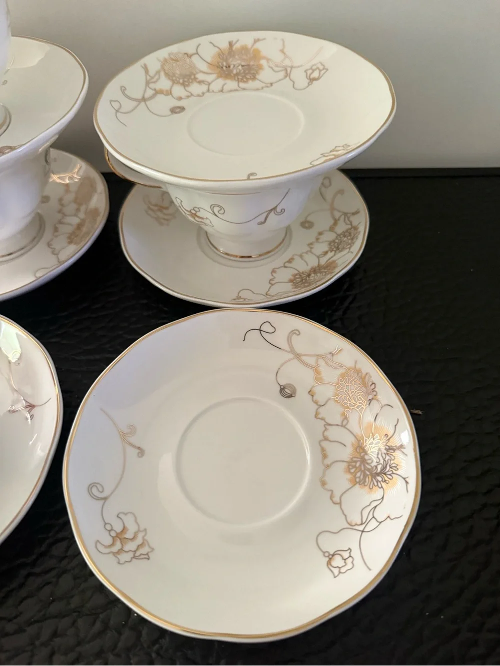 Set Of 6 cup and saucer feature the gold overglaze monogram White porcelain body